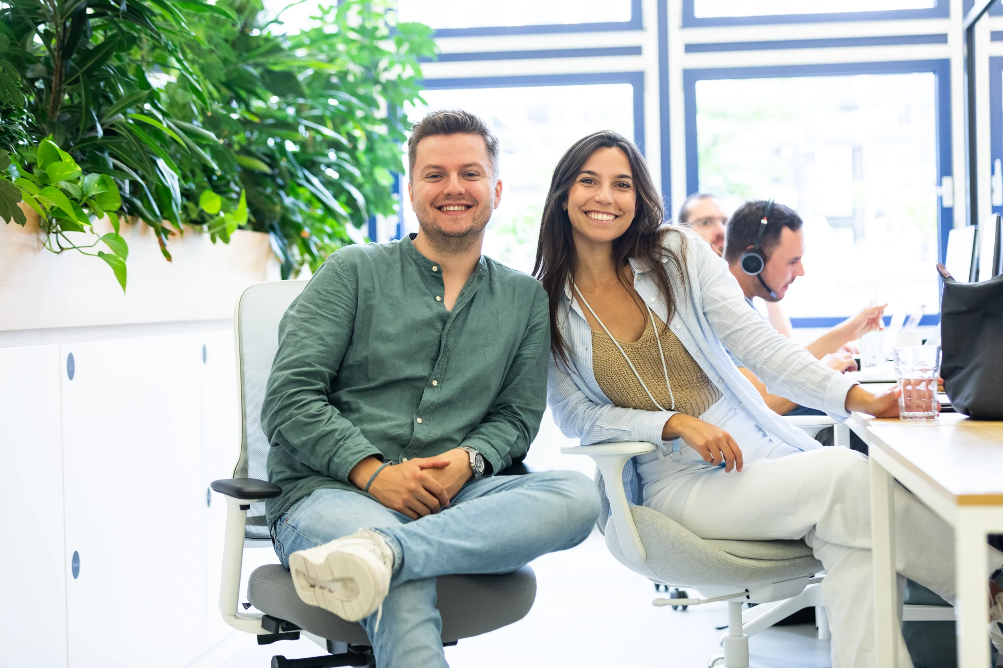 CX Cover picture two people smiling in the office