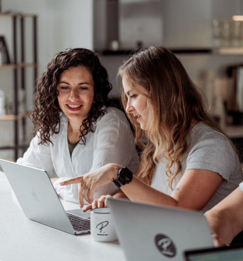 (Data) two women looking at laptop