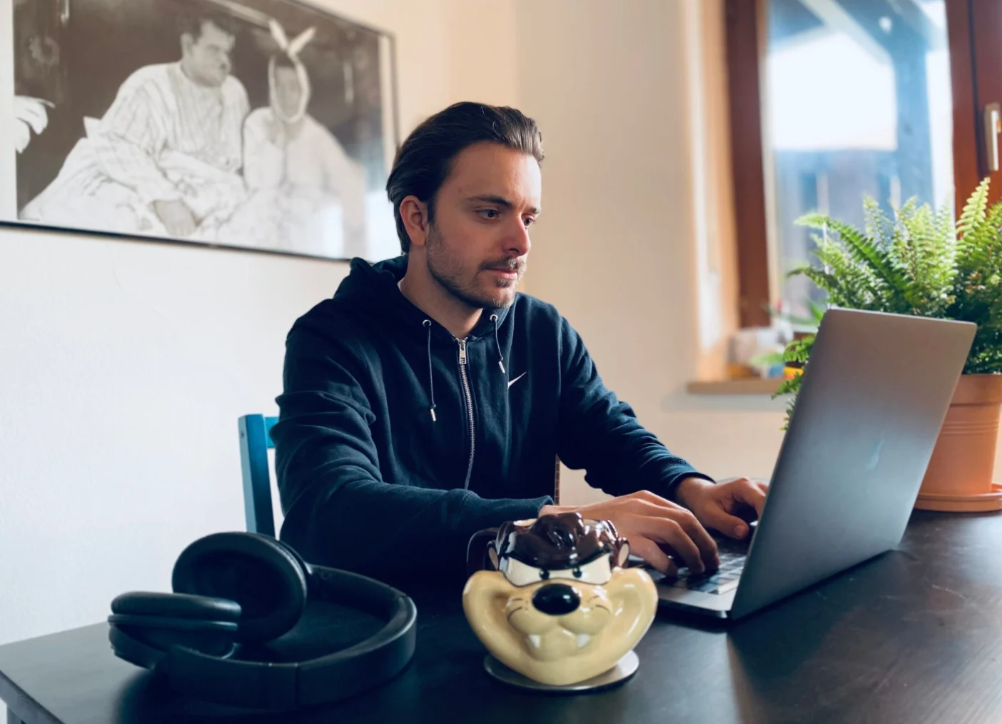 Kálmán working on a laptop