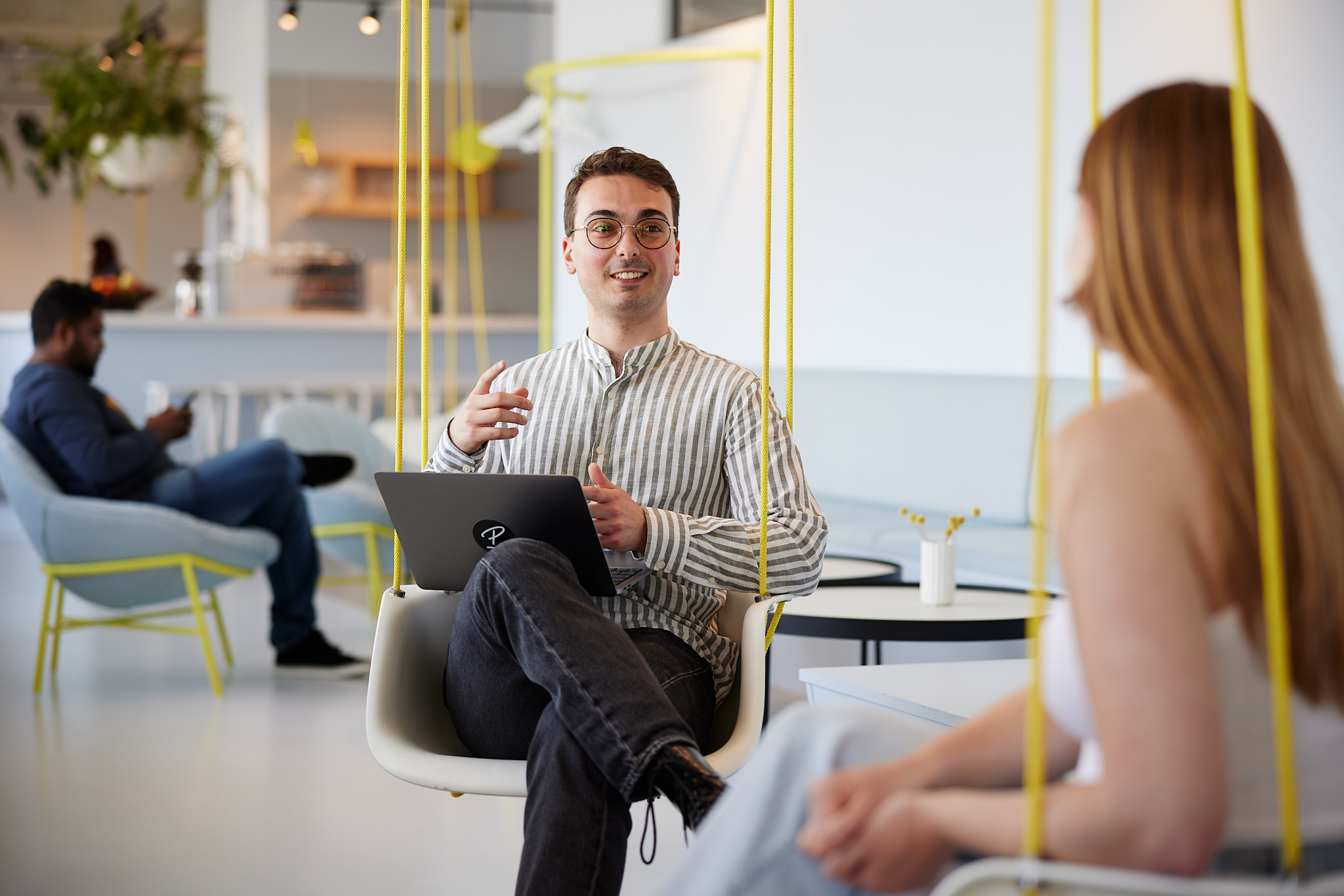 Smiling employee with blue collar shirt