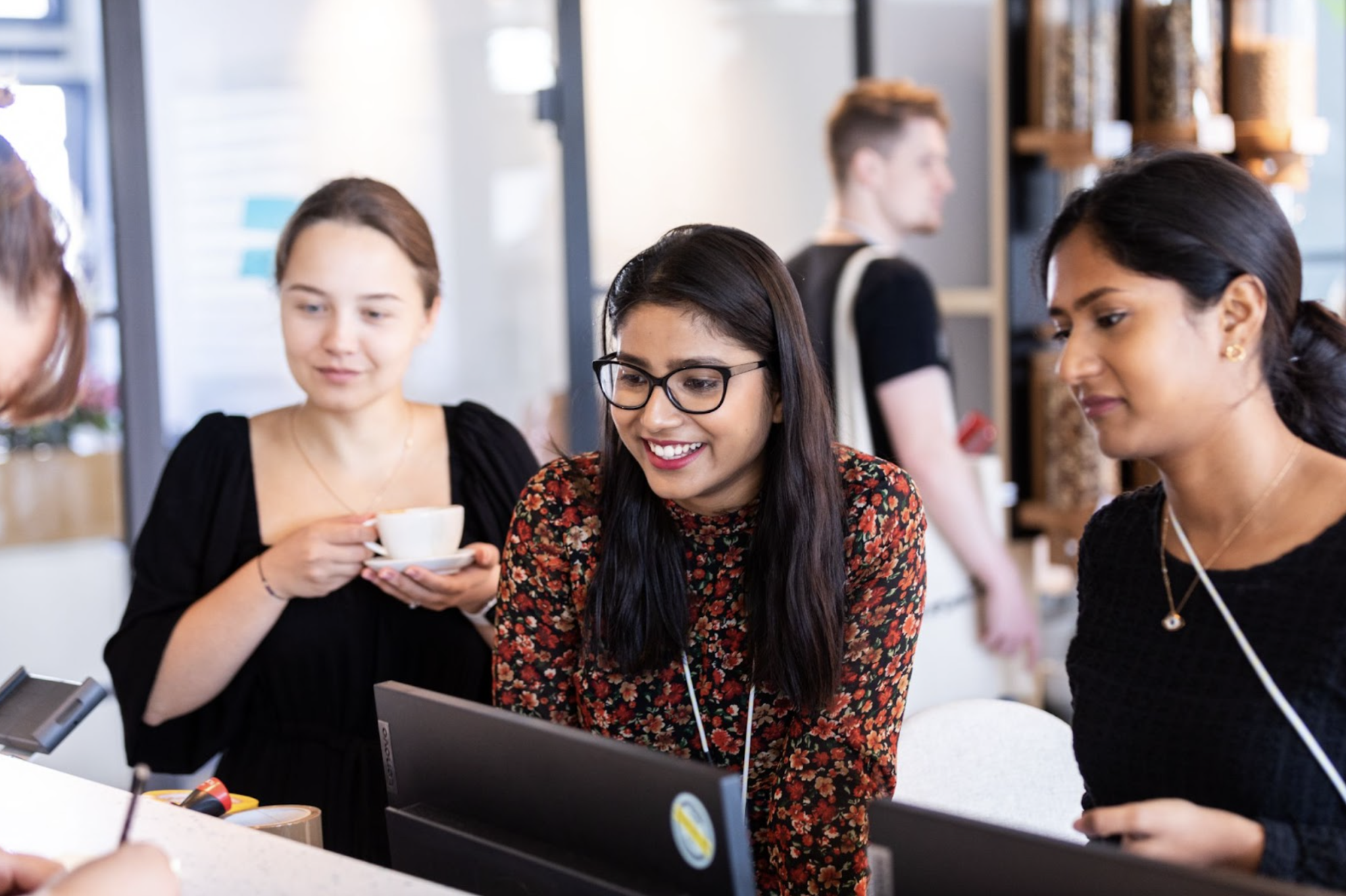 Female employees working at desk.