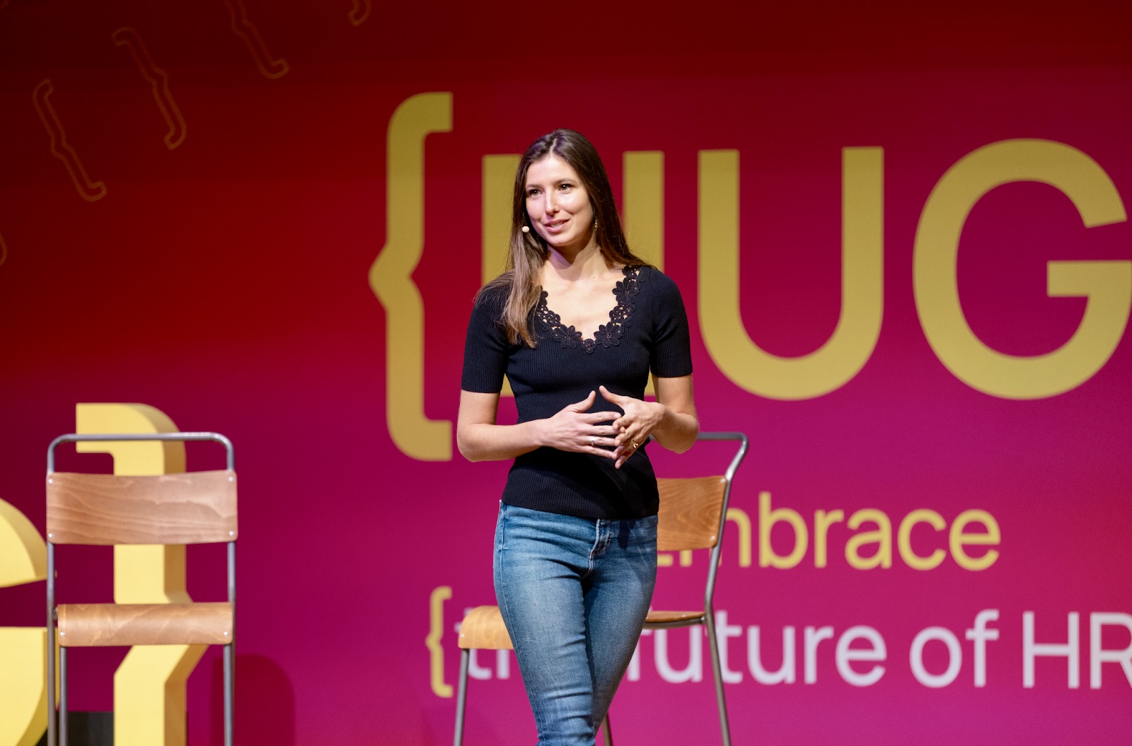 Marta presenting on stage at HUG