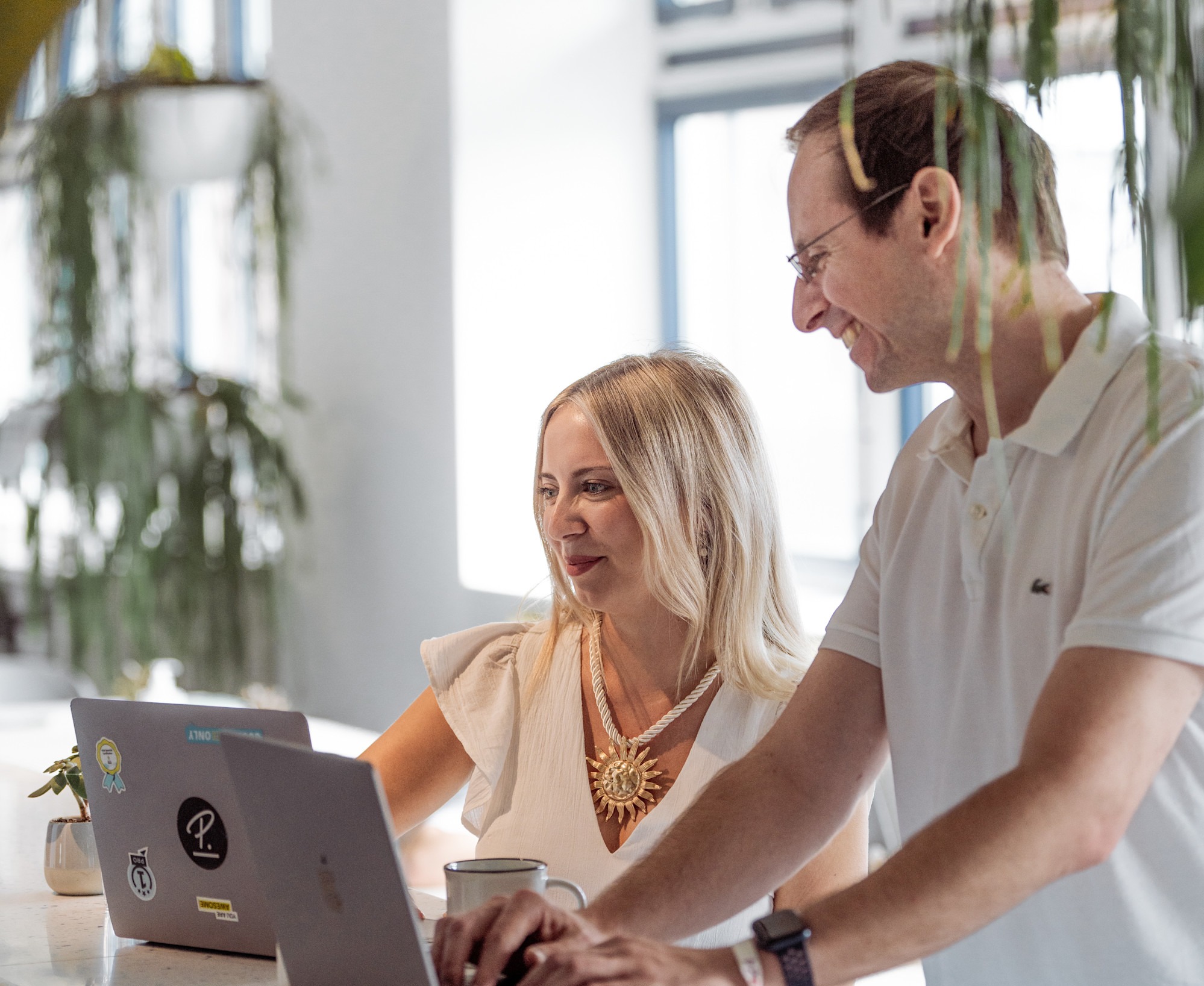 Man and woman looking at laptop