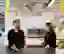 2 people at bar in office