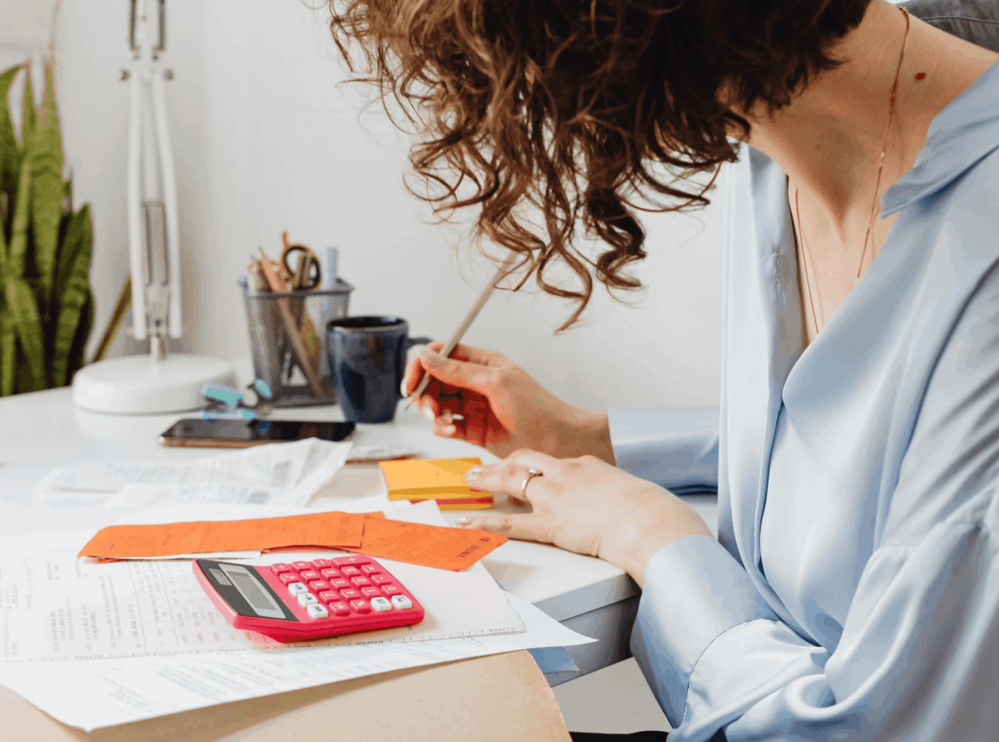 Female employee working on Compensation Management.