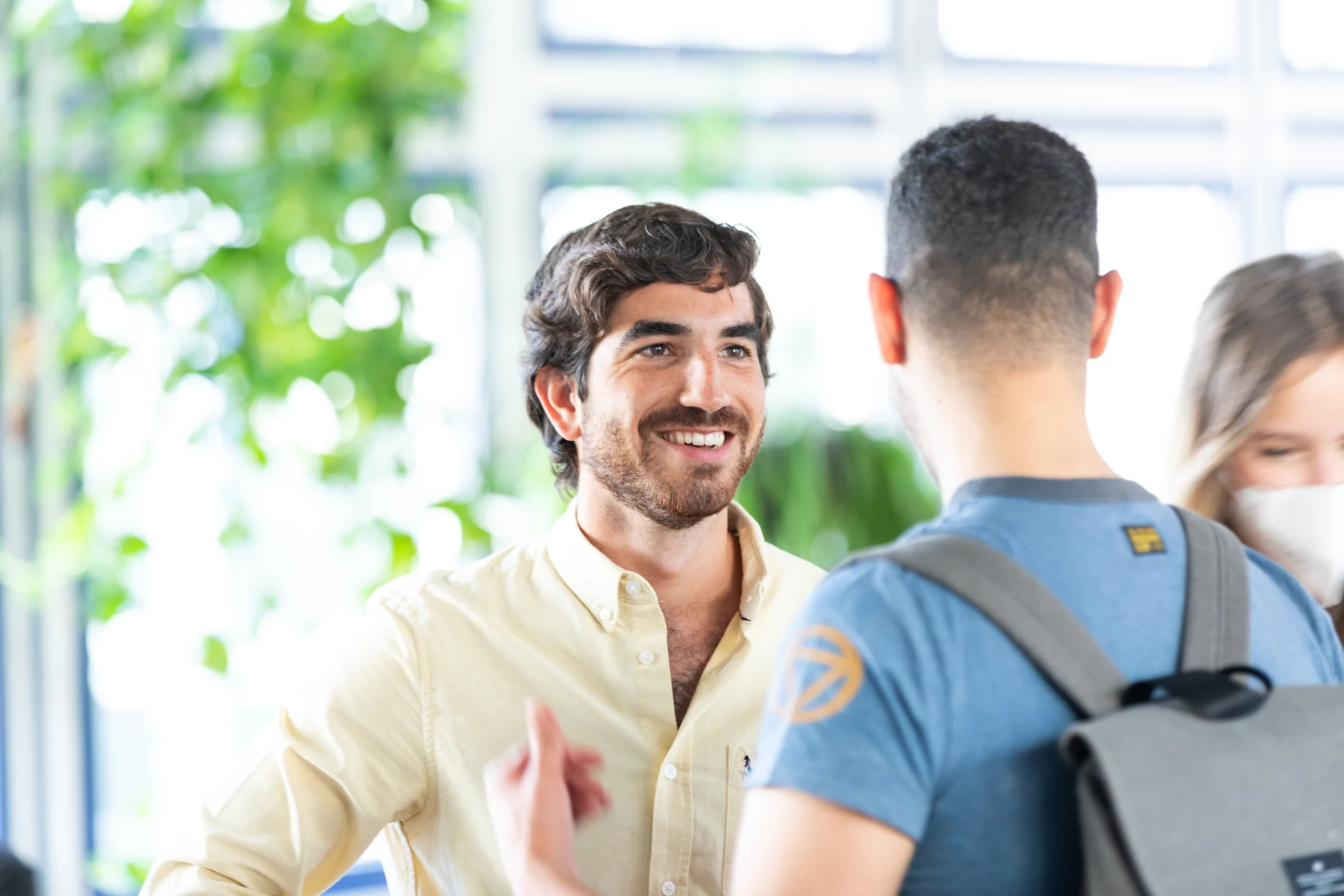 Sales cover photo two men talking in office