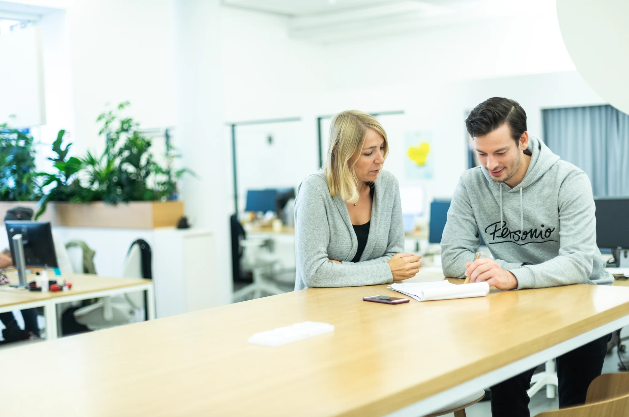 coworkers discussing verbal warning