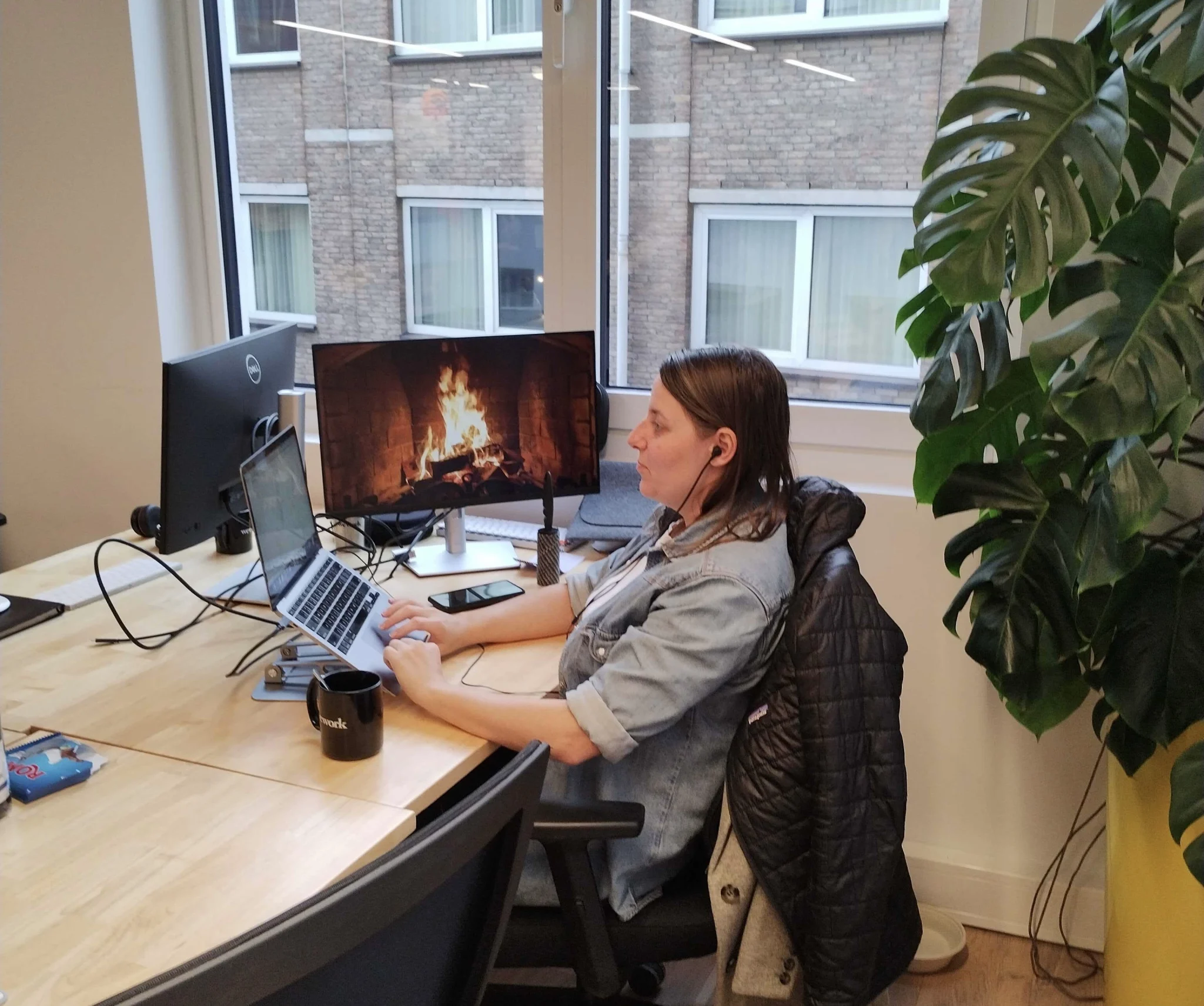 Anita Bax Working at her desk in Amsterdam office