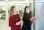 Two women working with sticky notes