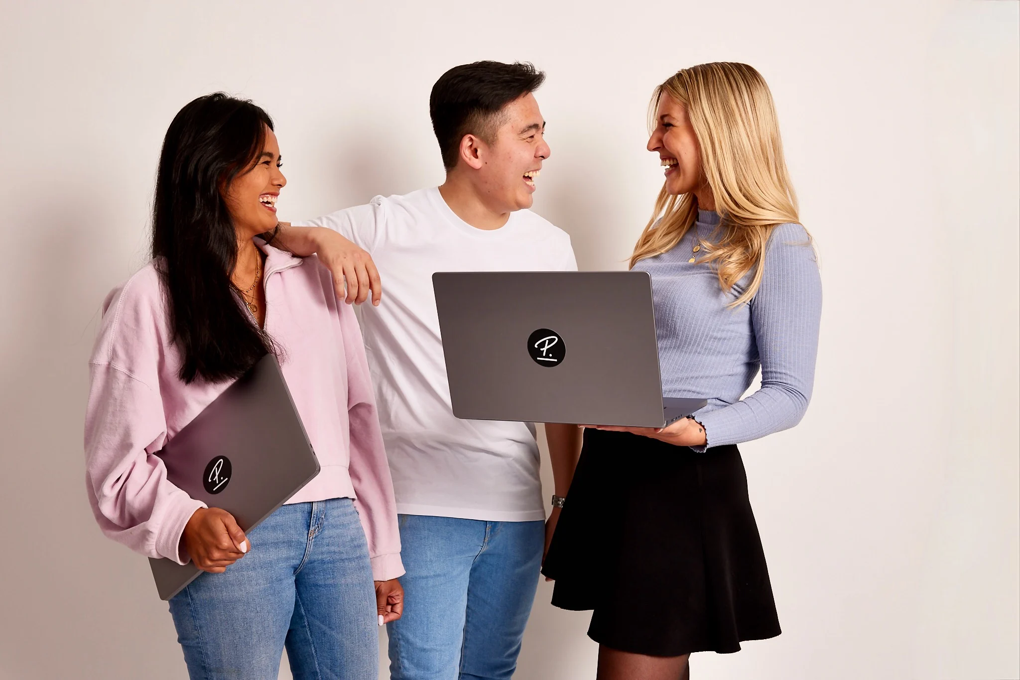 Students and Grads cover three junior personios laughing