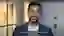 Man in office speaking to camera