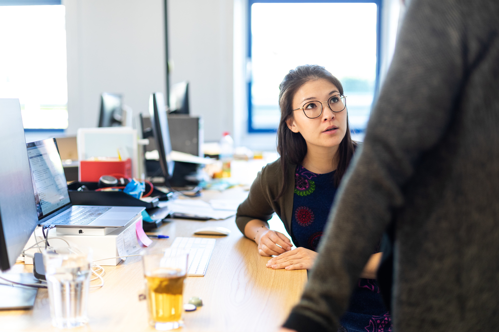 employee discussing outcomes vs outputs