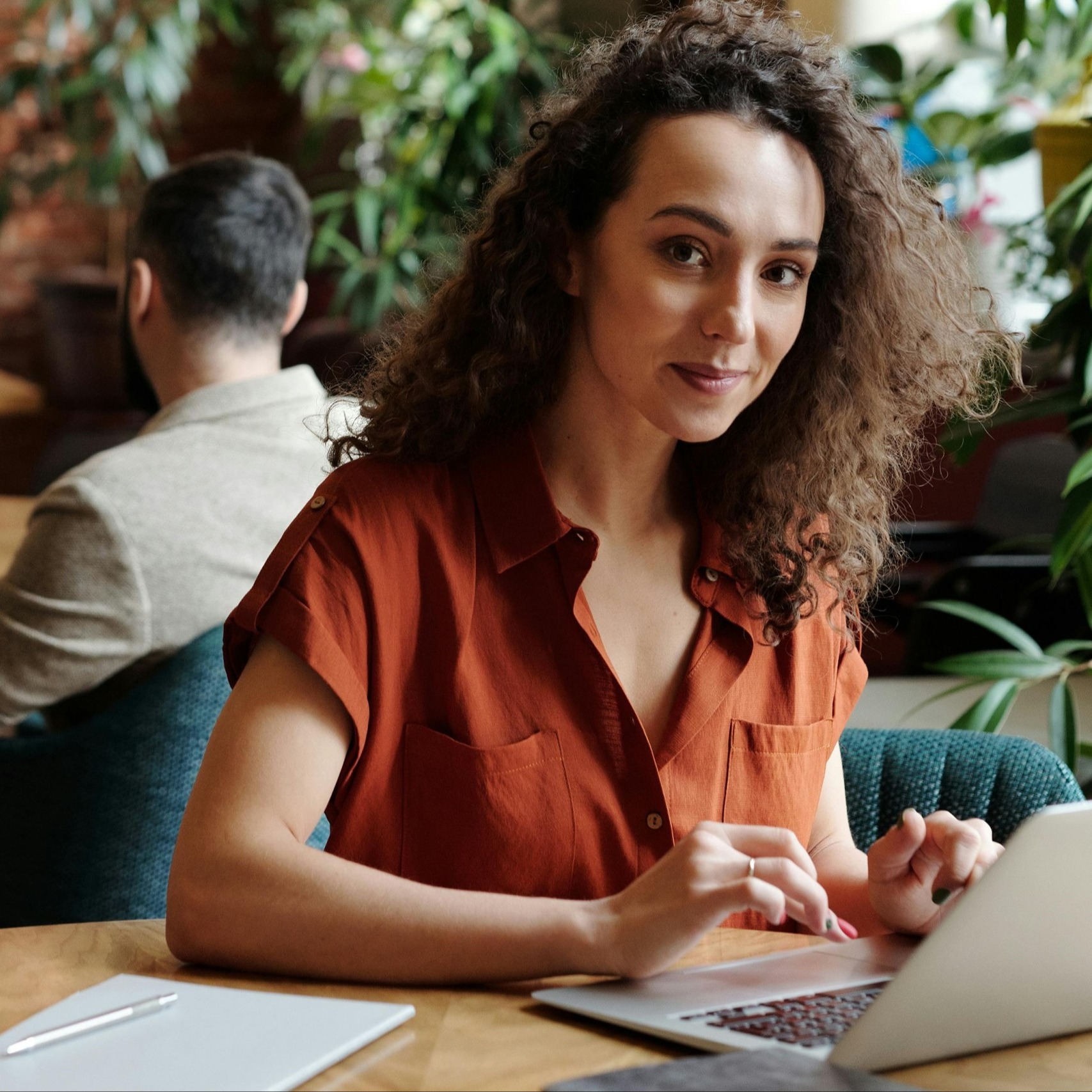 Female employee sitting in front of computer