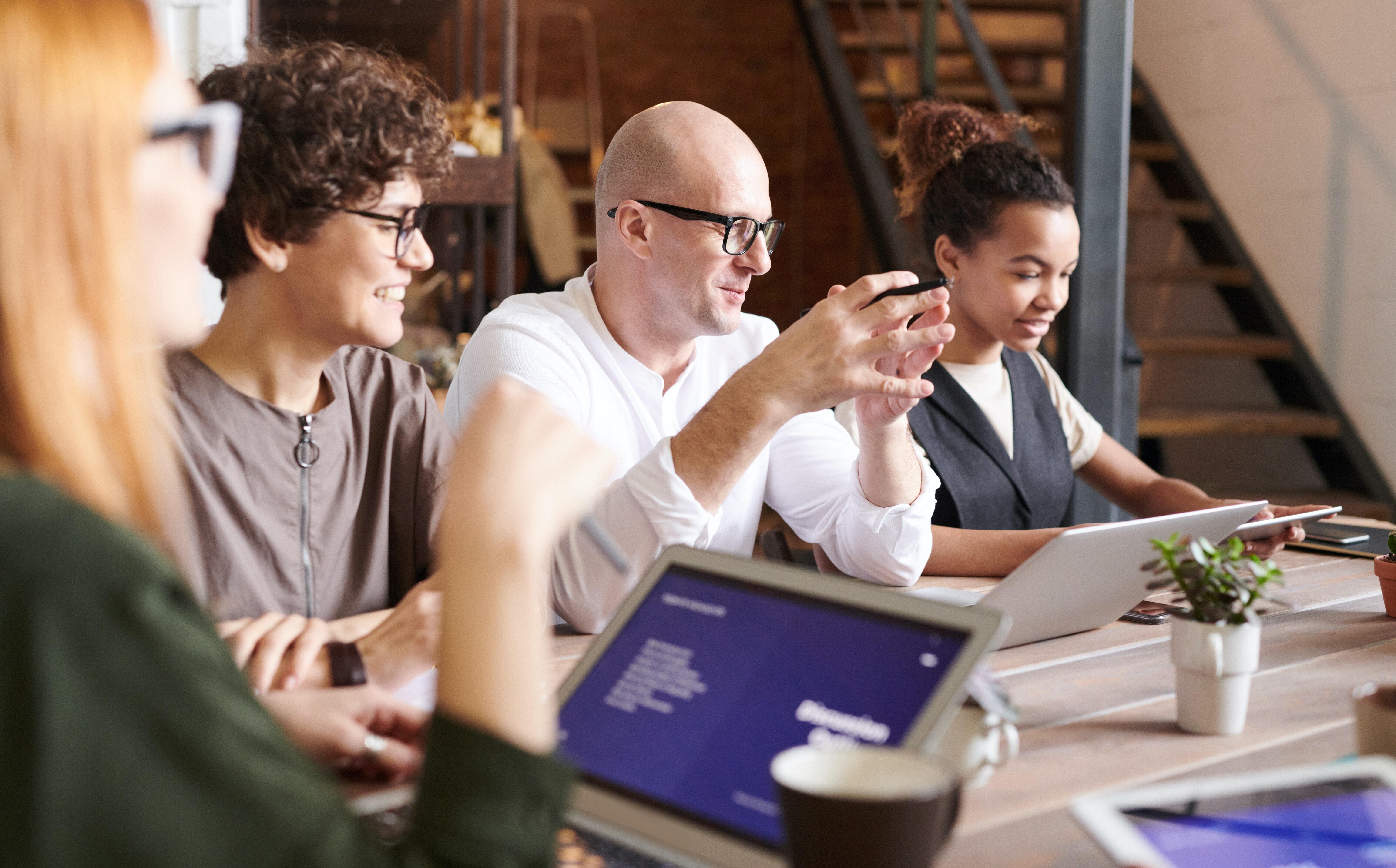 People chatting in a meeting