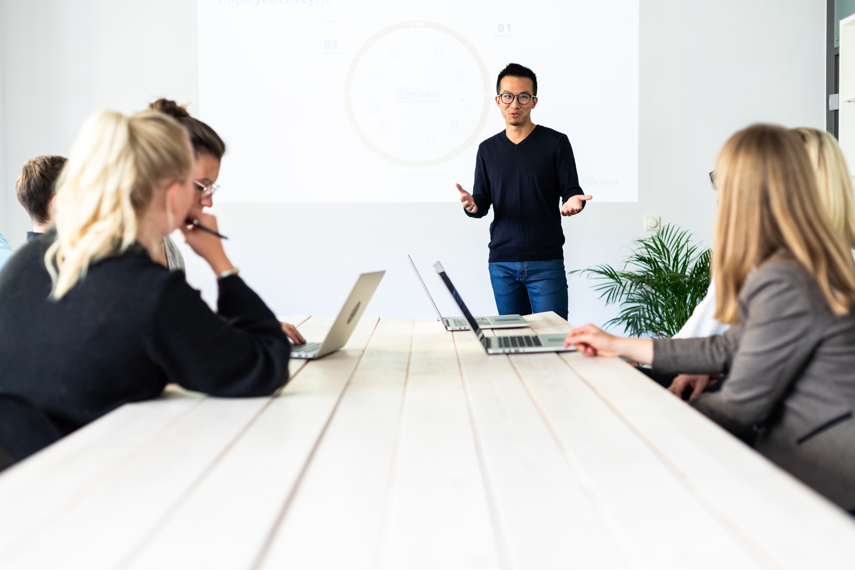 employee explaining an employee engagement survey to staff