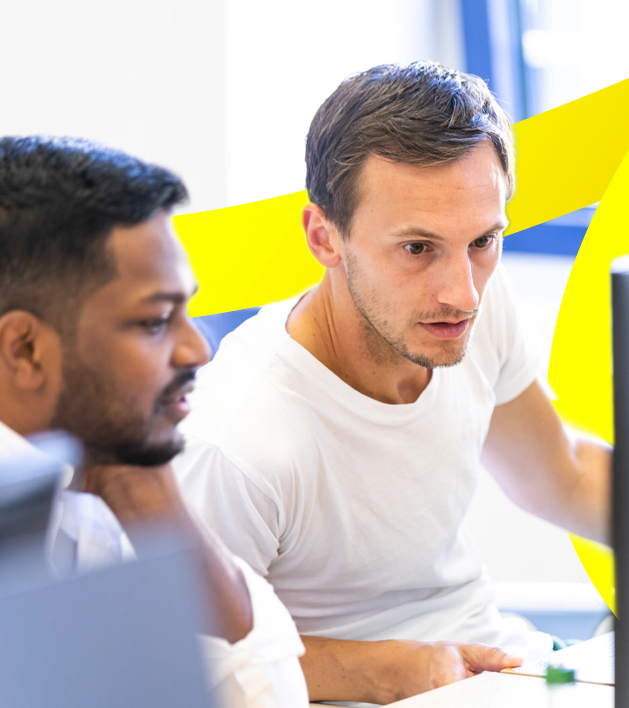 2 Employees in front of screen