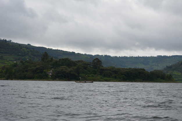 Tourists canoeing on Lake Bunyonyi which is the second deepest lake in Africa.
