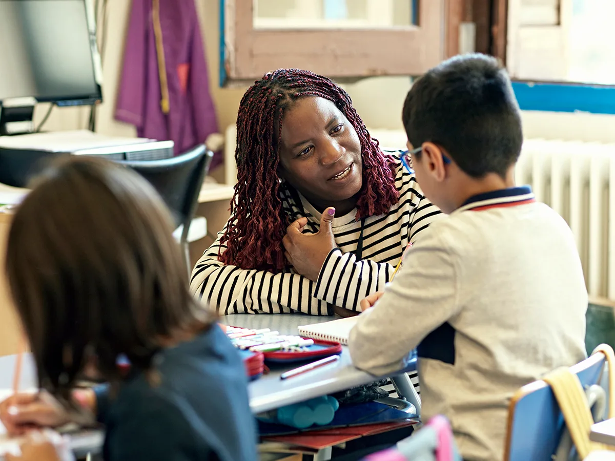 Respectful redirection: A behavior strategy for teachers, teacher talking to a student