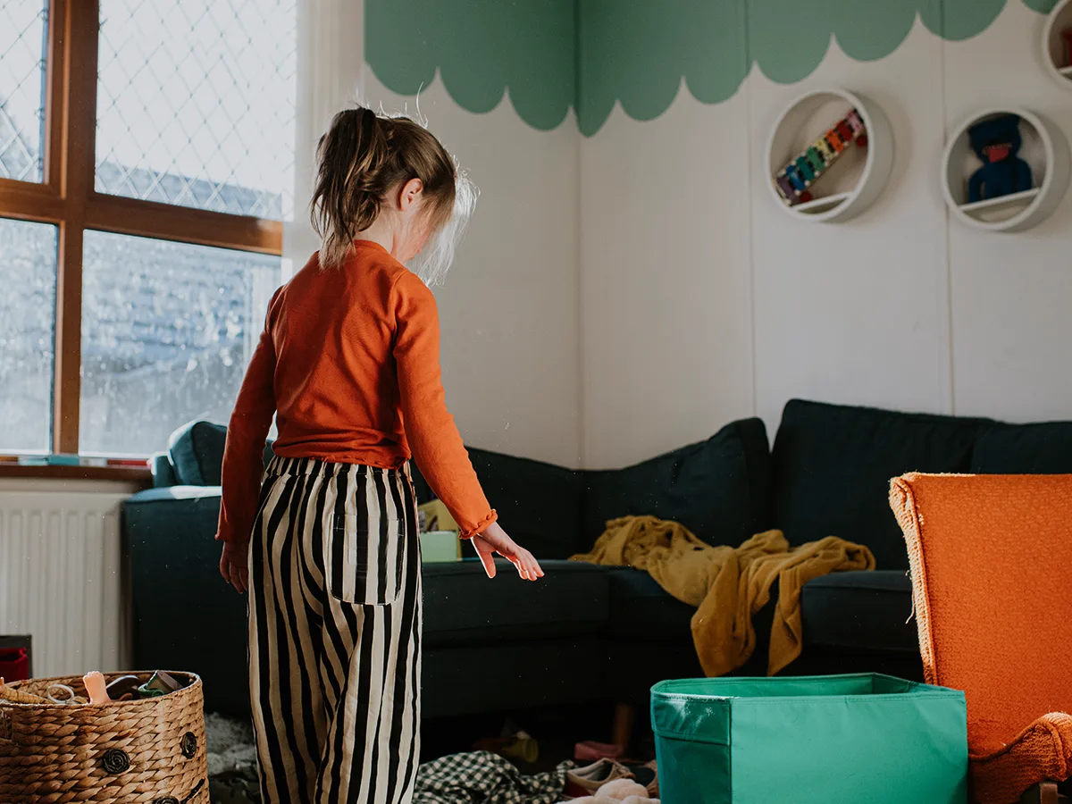 Why being messy can make kids anxious, kid looking at a cluttered room
