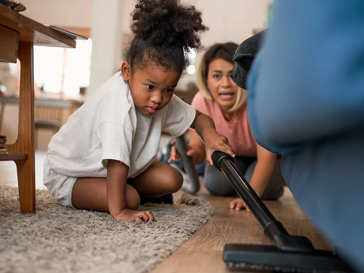 5 Smart Chores for Kids With Extra Energy, girl vacuuming