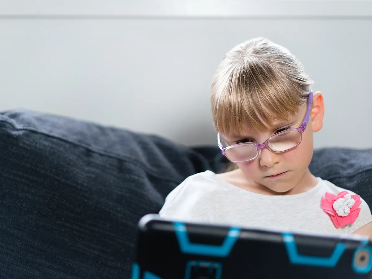 How to tell if your child is being bullied online, child on an ipad