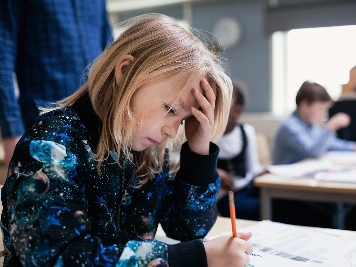 Math anxiety vs. dyscalculia in kids: Comparing the signs, girl doing math