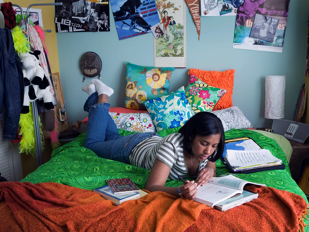 5 ways to avoid homework battles with your teen or tween. A teen does their homework in their room. 