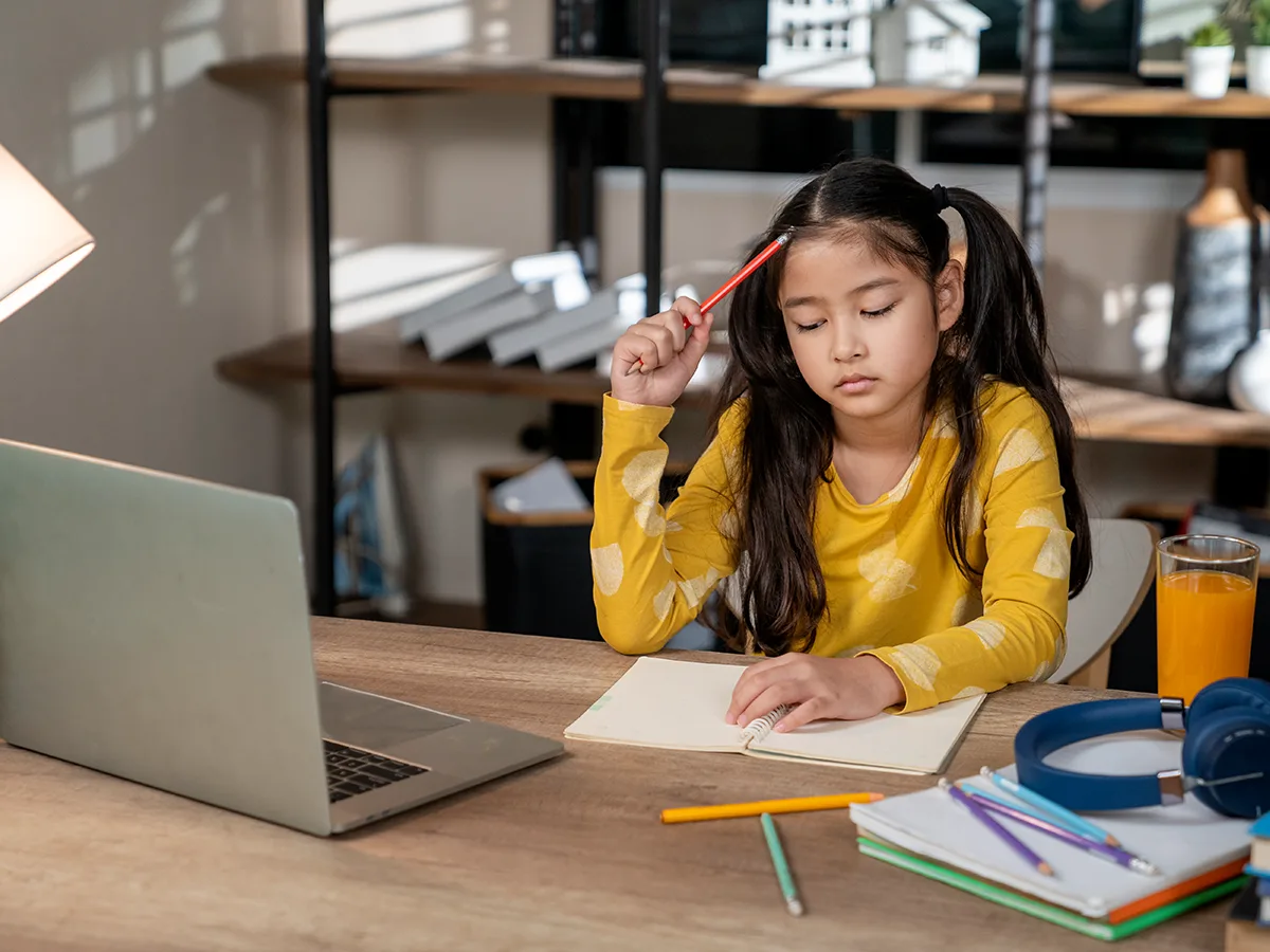 8 Tips to Help Middle-Schoolers Slow Down on Homework. girl doing homework at home