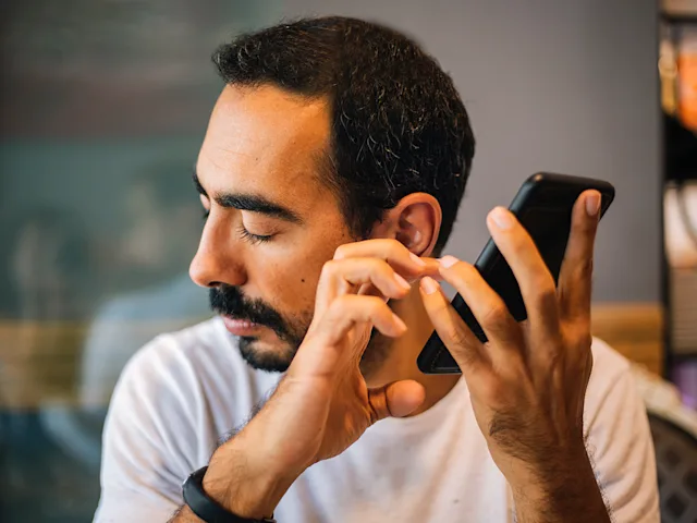 Assistive technology that's built into mobile devices, blind man using assistive tech on his cell phone