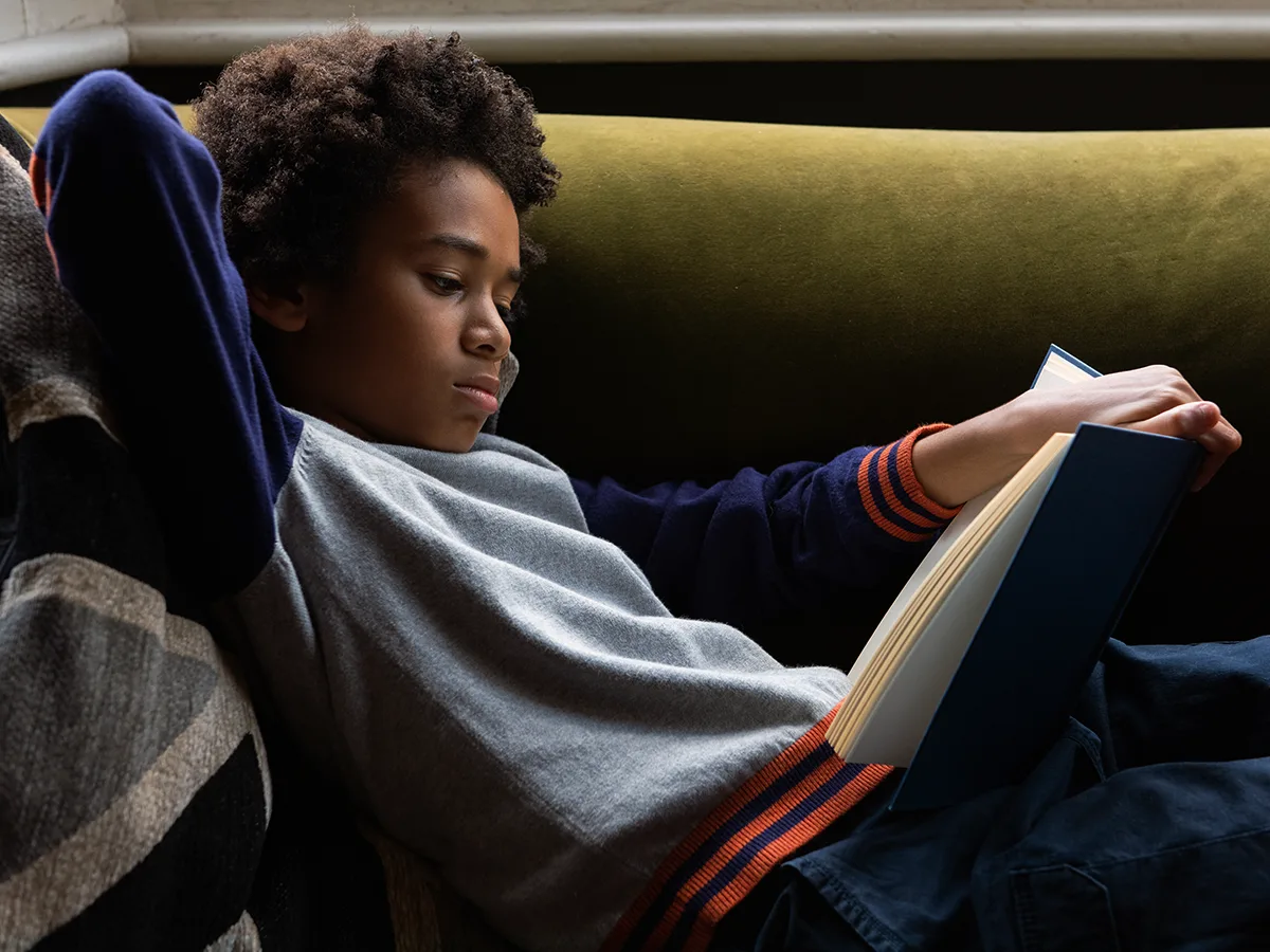 A child reads a book. 