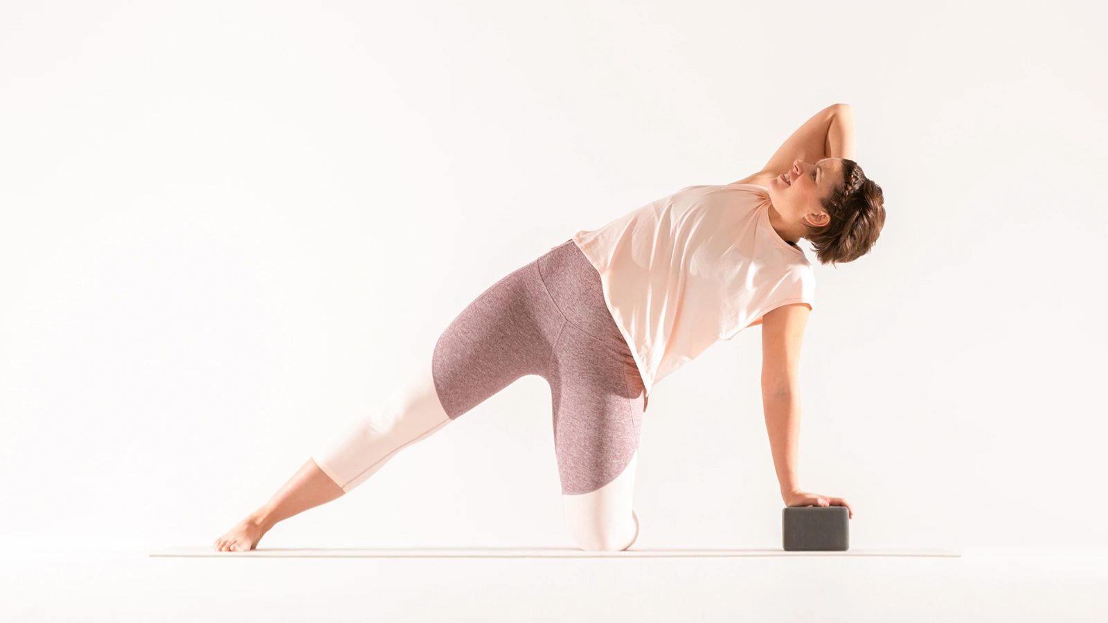 This side bending pose stretches the sides of the body while