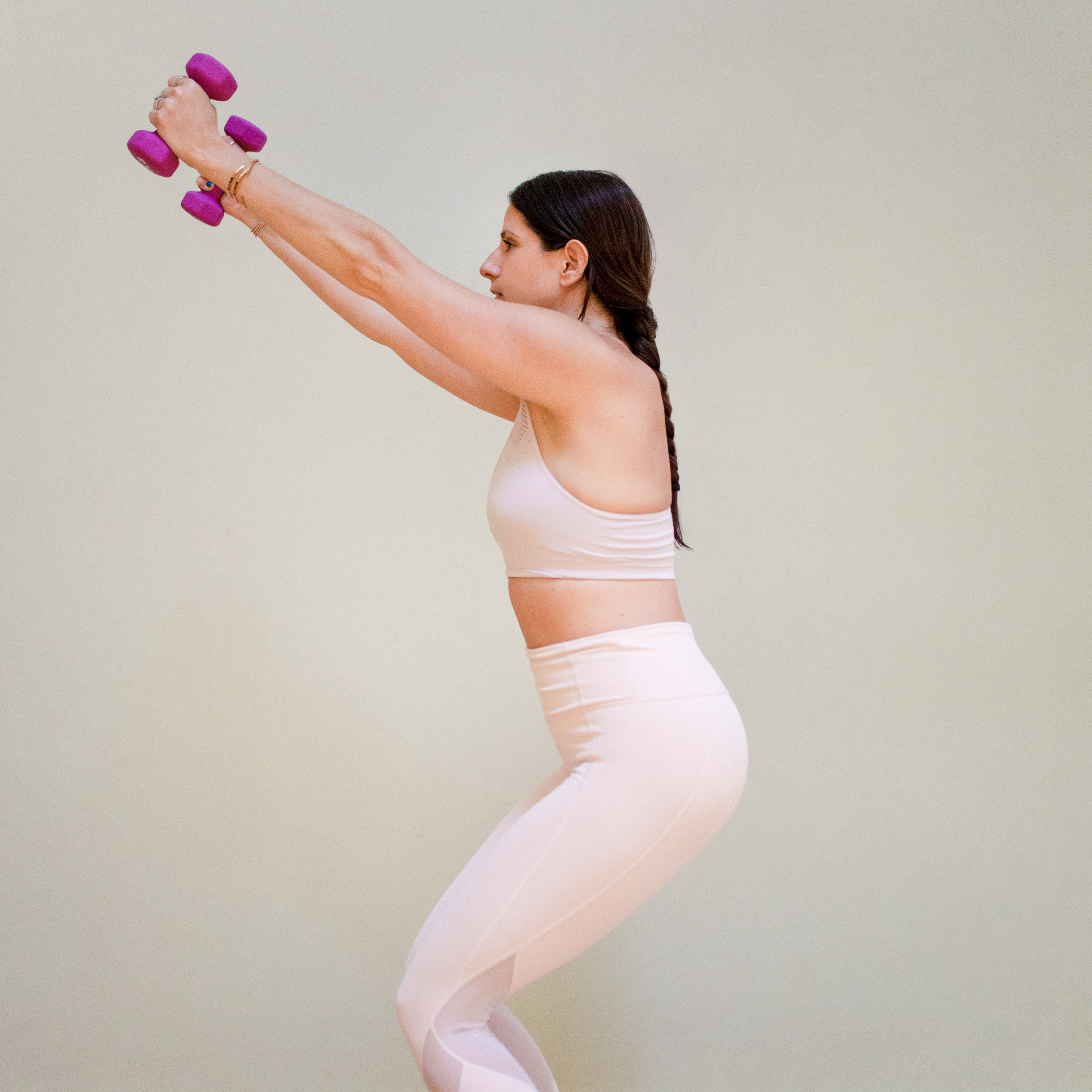Woman Stretches; Studio Dumbbells - Stock Video | Motion Array
