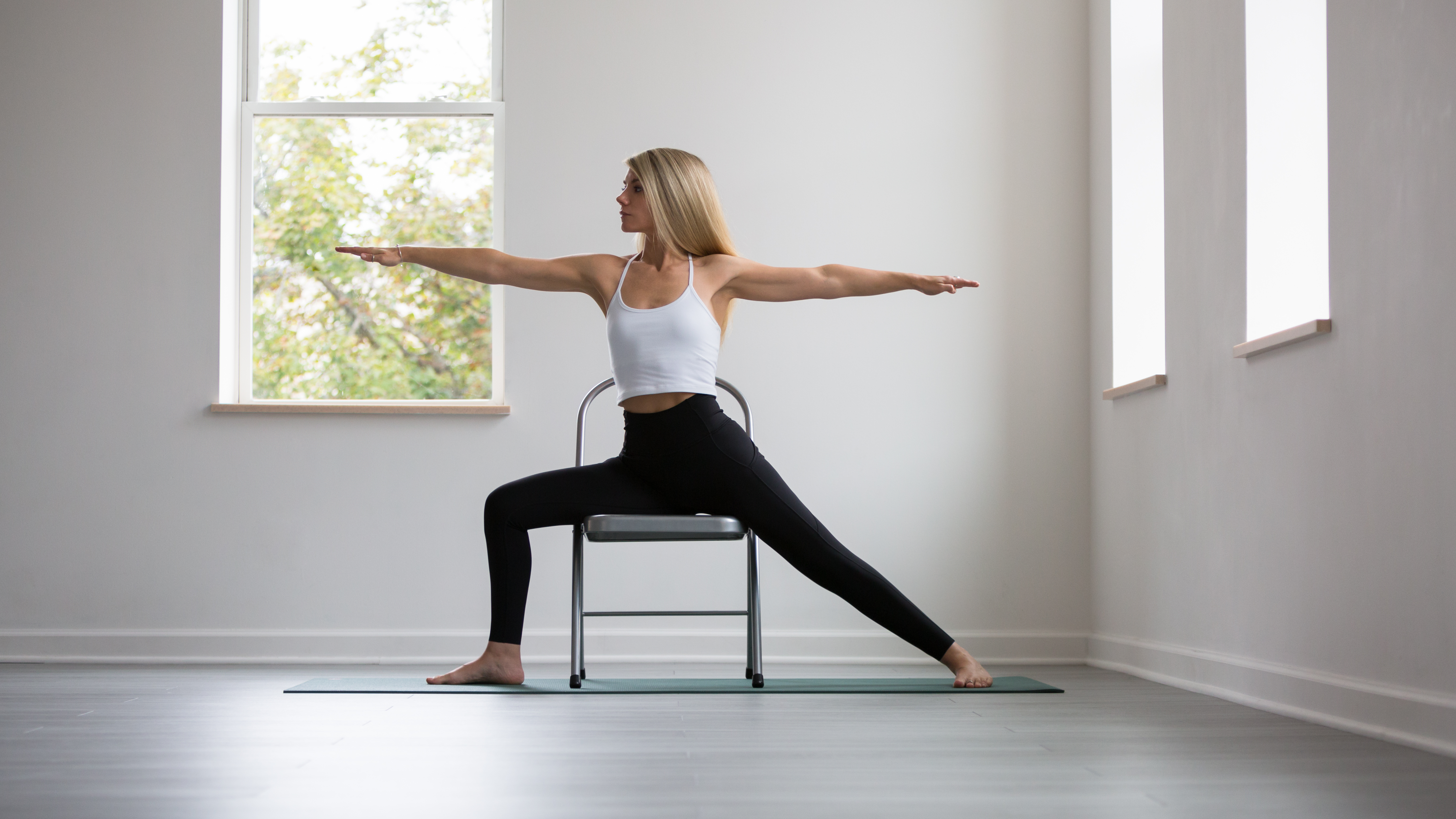 This chair pose variation will help you handstand in yoga class | Well+Good