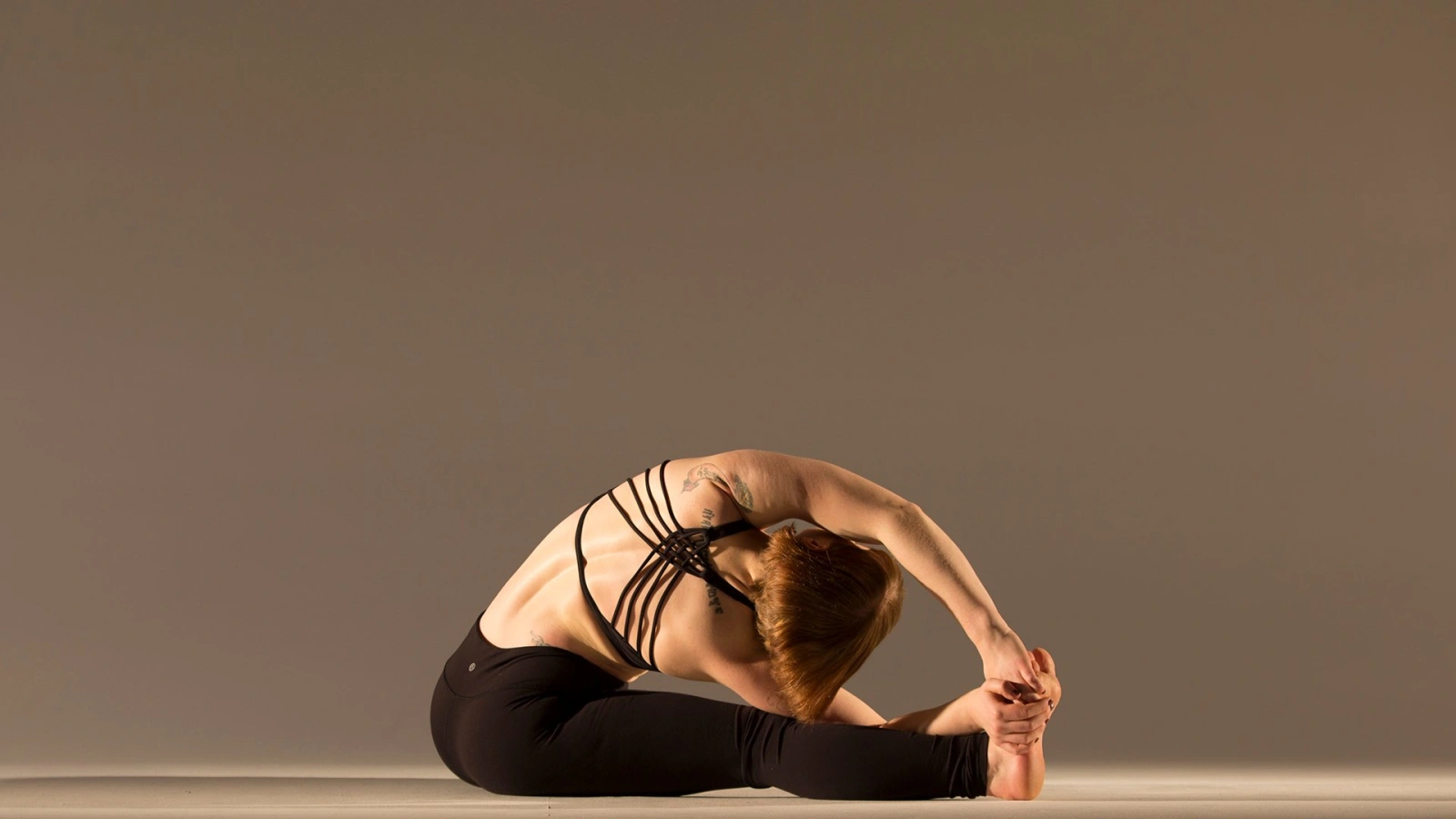 Indian Acro Yoga - Parivrtta Janu Sirsasana is twisted-head-to-knee forward  bending pose. This restorative asana energises the body and mind, while  toning the obliques.  This asana increases the flexibility of the