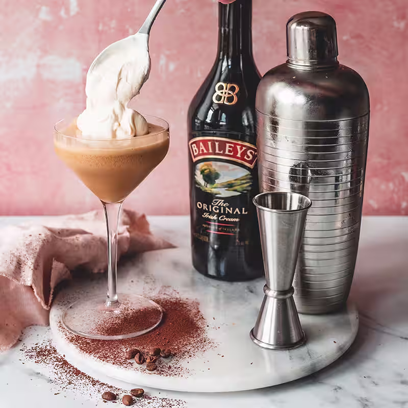 Baileys Original Irish Cream with a cocktail and mixer.