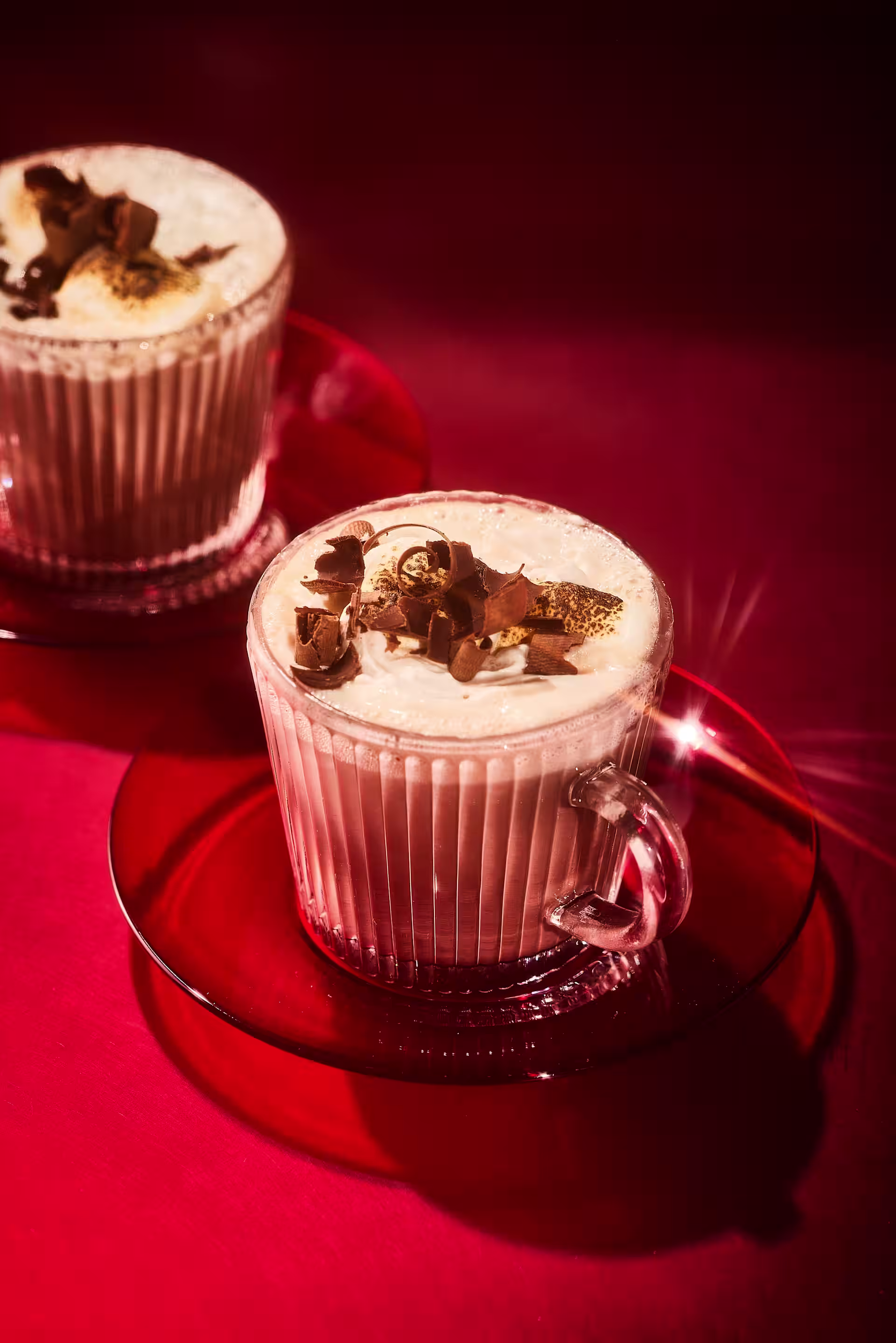 Hot chocolate mugs with red background
