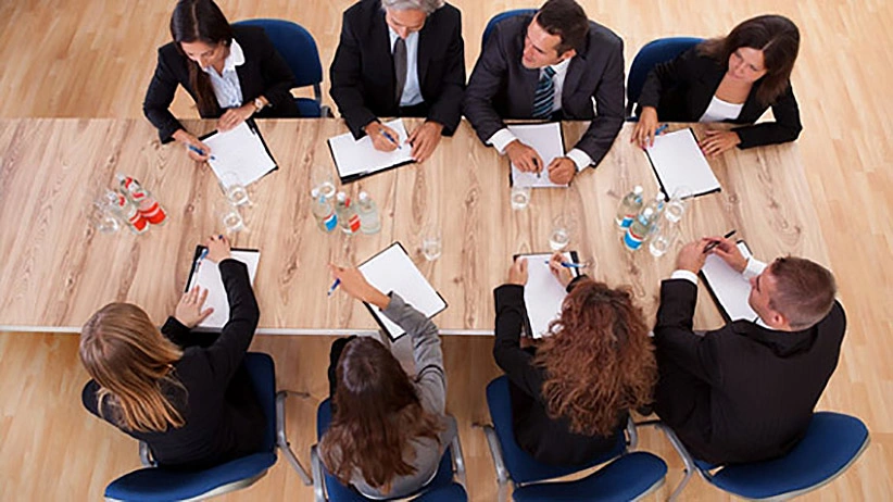 Board meeting in a room with a table