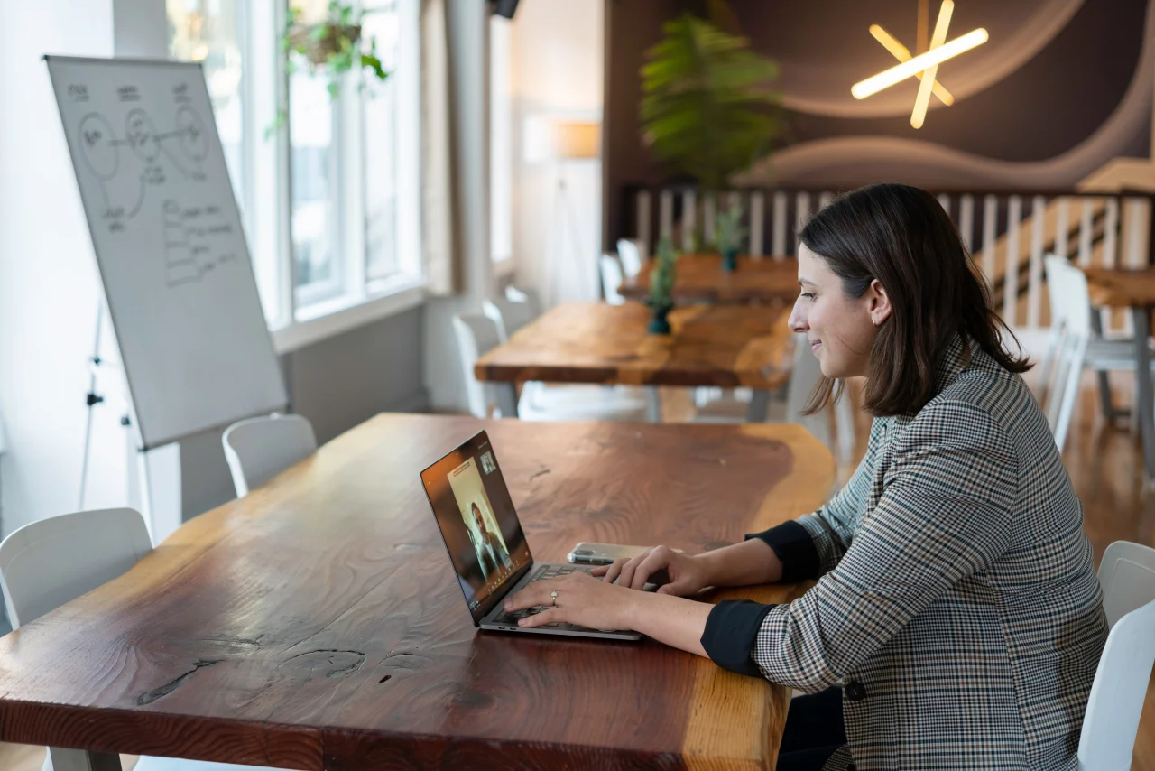 Two people in a virtual meeting talk about donations