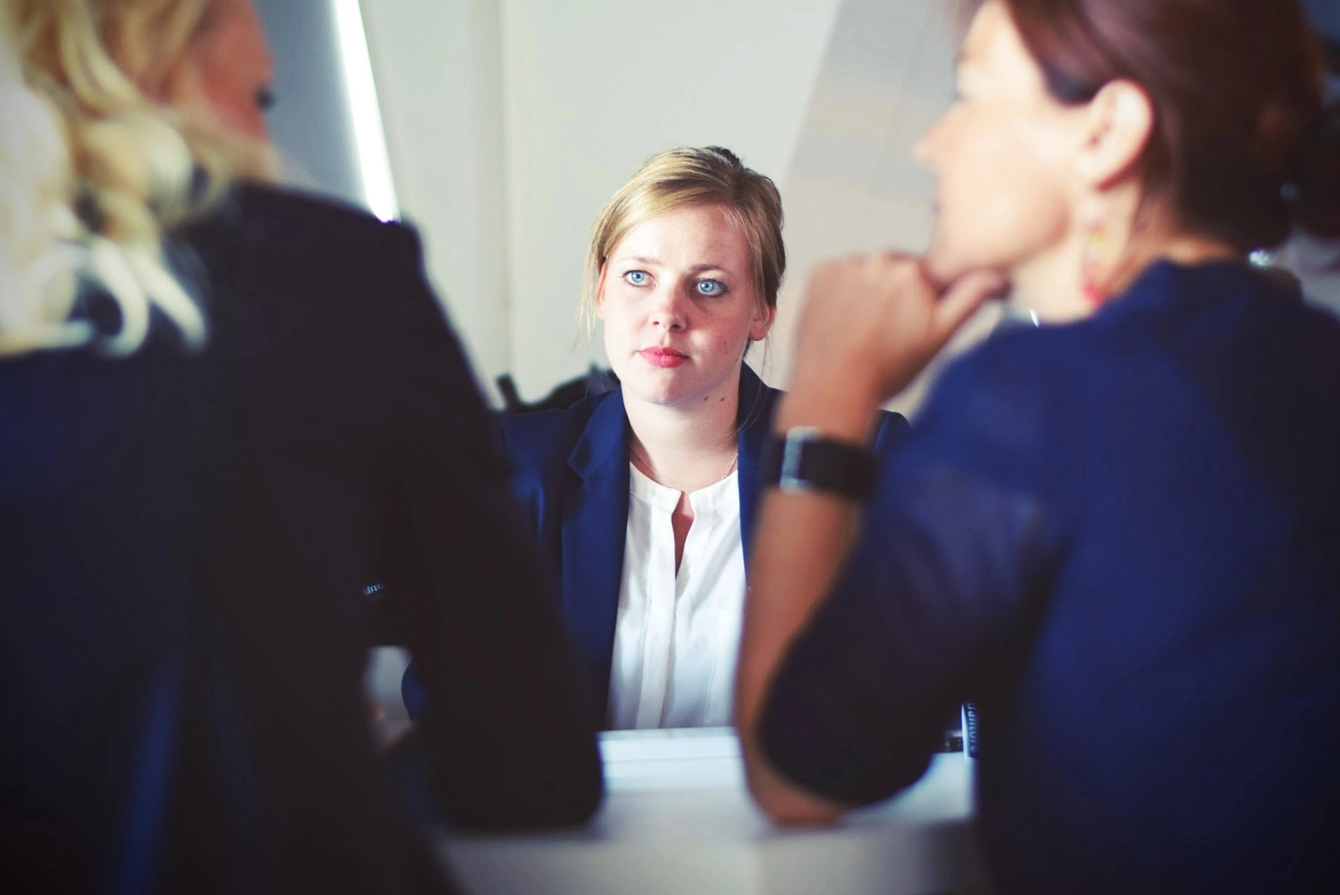 Three women in a hiring interview with talented candidates