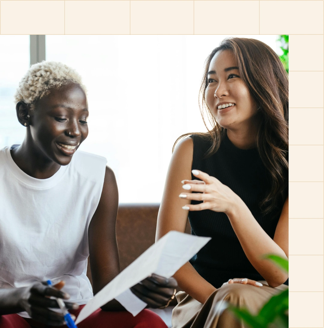 Two professional women smiling