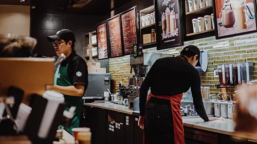 Baristas making beverage in a coffeeshop