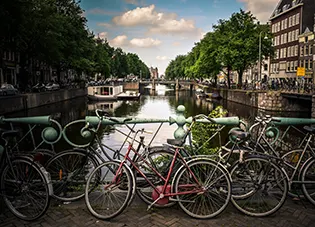 Bicycles parked on a bridge in Amsterdam