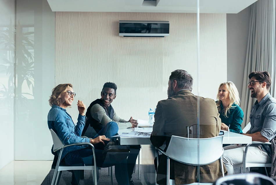 Group meeting in glass office