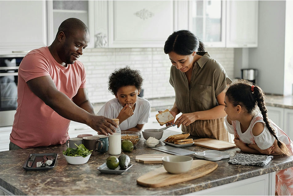 A family is spending time together in the kitchen