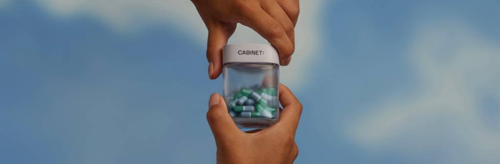 Hands on prescription bottle