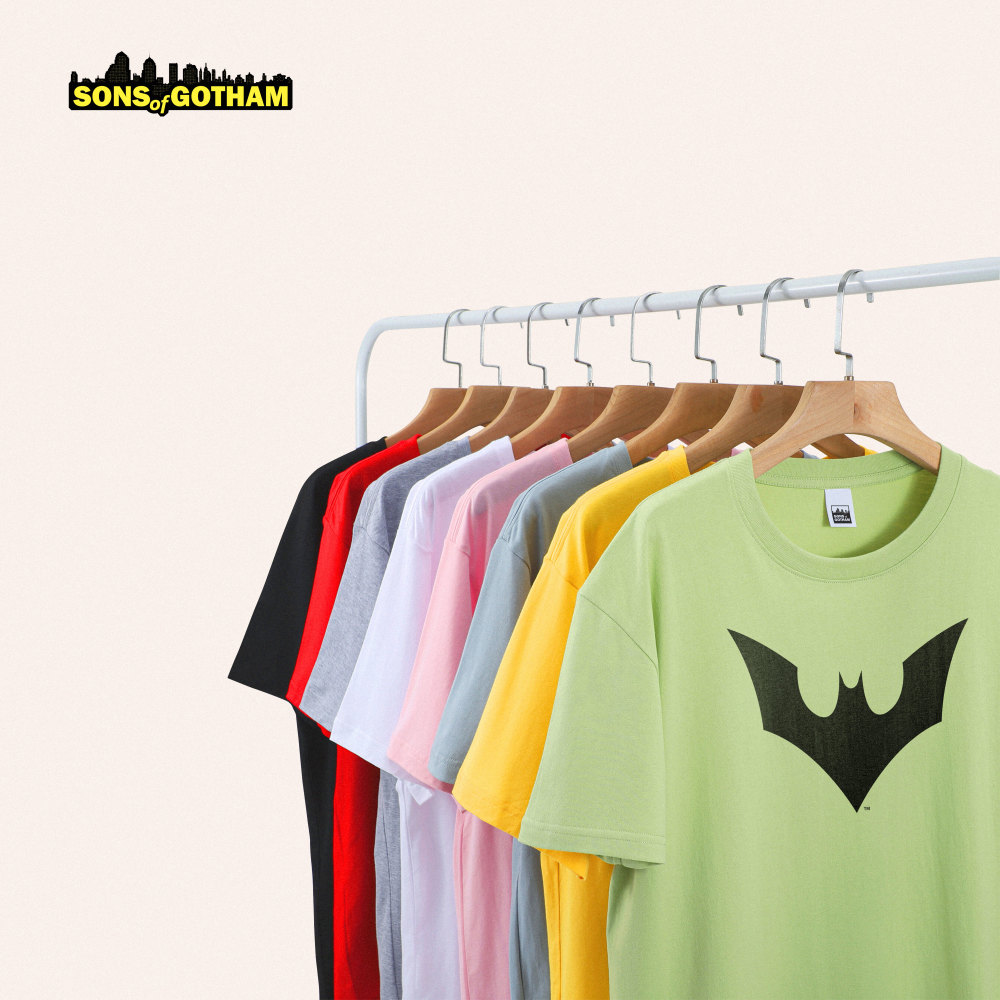 Sons of Gotham brand image. A collection of multi-colored t-shirts hanging up.