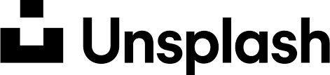 Unsplash written in black on a white background