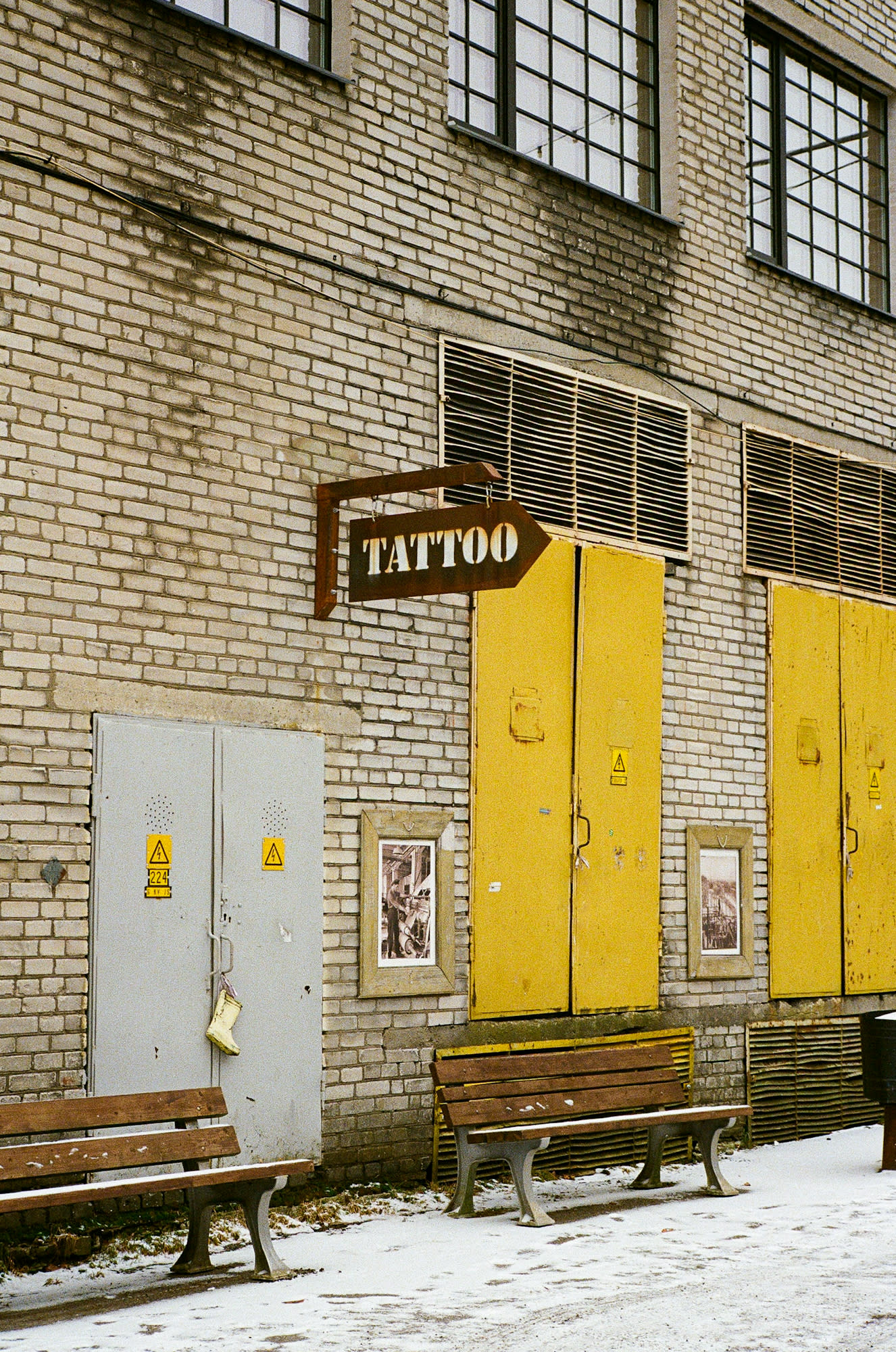 Tattoo sign above electricity sector door.