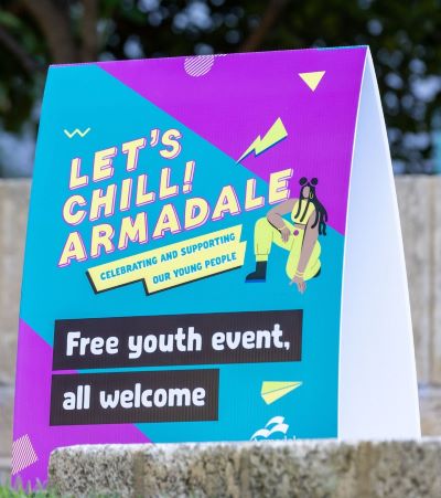 Sign saying Let's Chill Armadale, Free Youth Event, all welcome.