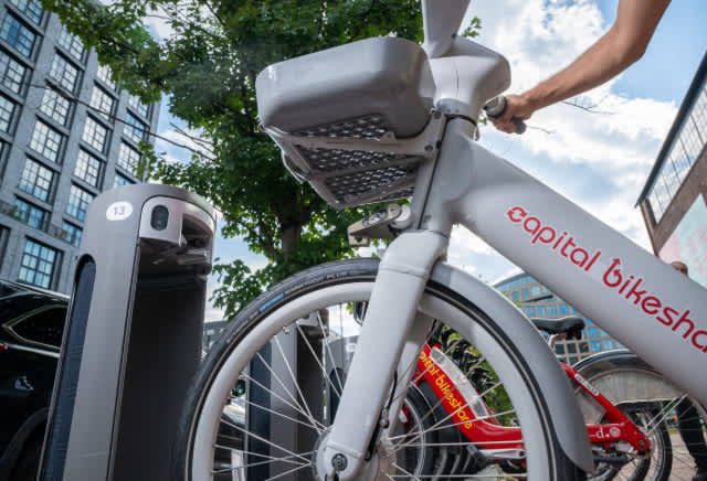 Close up of an ebike close to a Pillar dock to illustrate ebike parking
